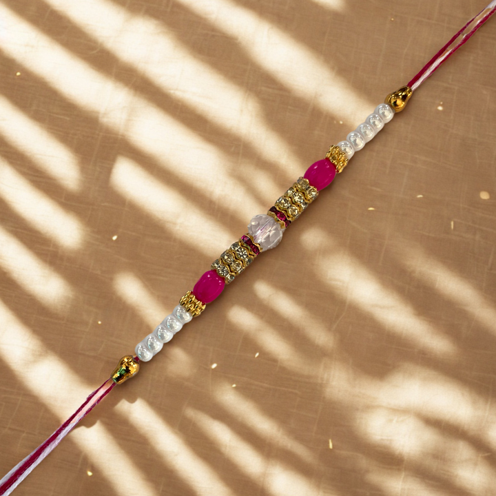 Royal Pink Crystal Rakhi with Golden Accents