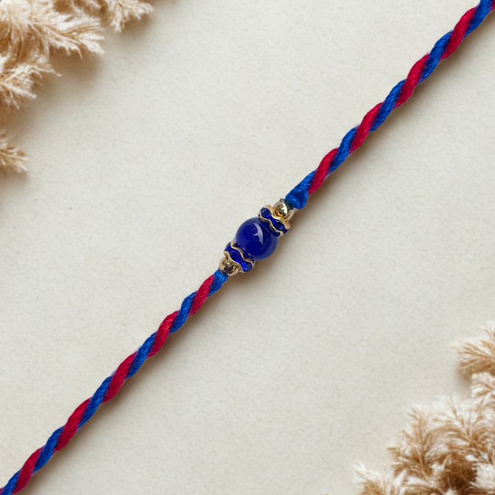 Minimal Blue Bead Rakhi on Dual-Tone Thread