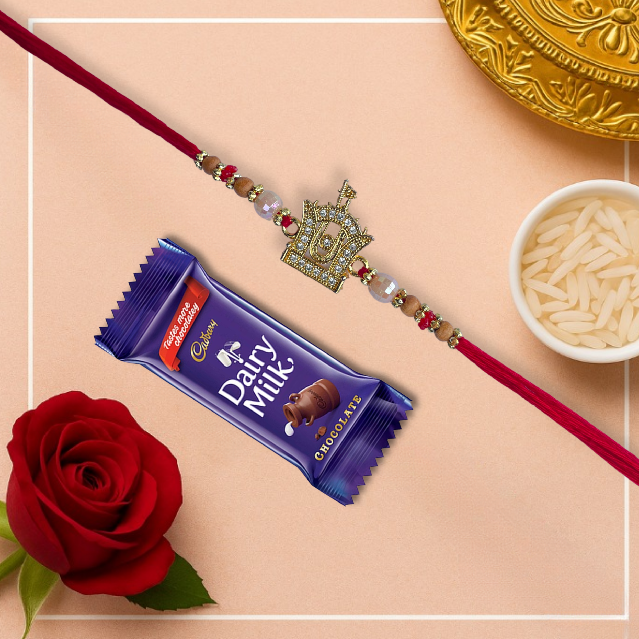 Swaminarayan Akshar Deri Motif Golden Rakhi with Cadbury Dairy Milk Chocolate Bar , 21 g