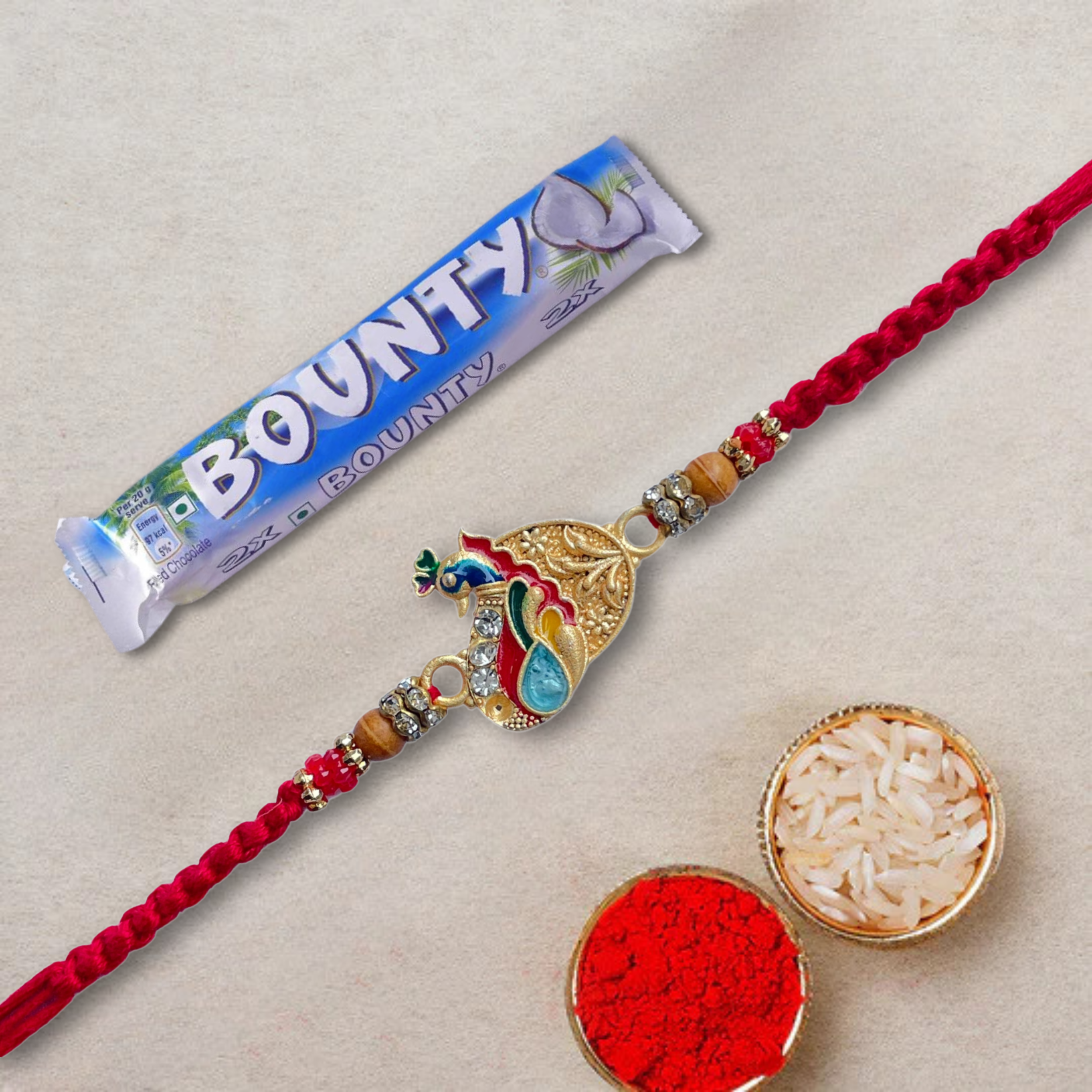 Elegant Peacock Design Rakhi with Bounty Milk Chocolate Bar - Coconut Filled, 57 g