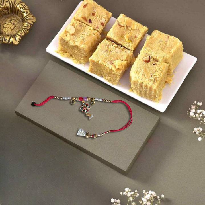 Divine Kalasham Sacred Charm Rakhi with Haldiram's Soan Papdi, 250 g Pouch