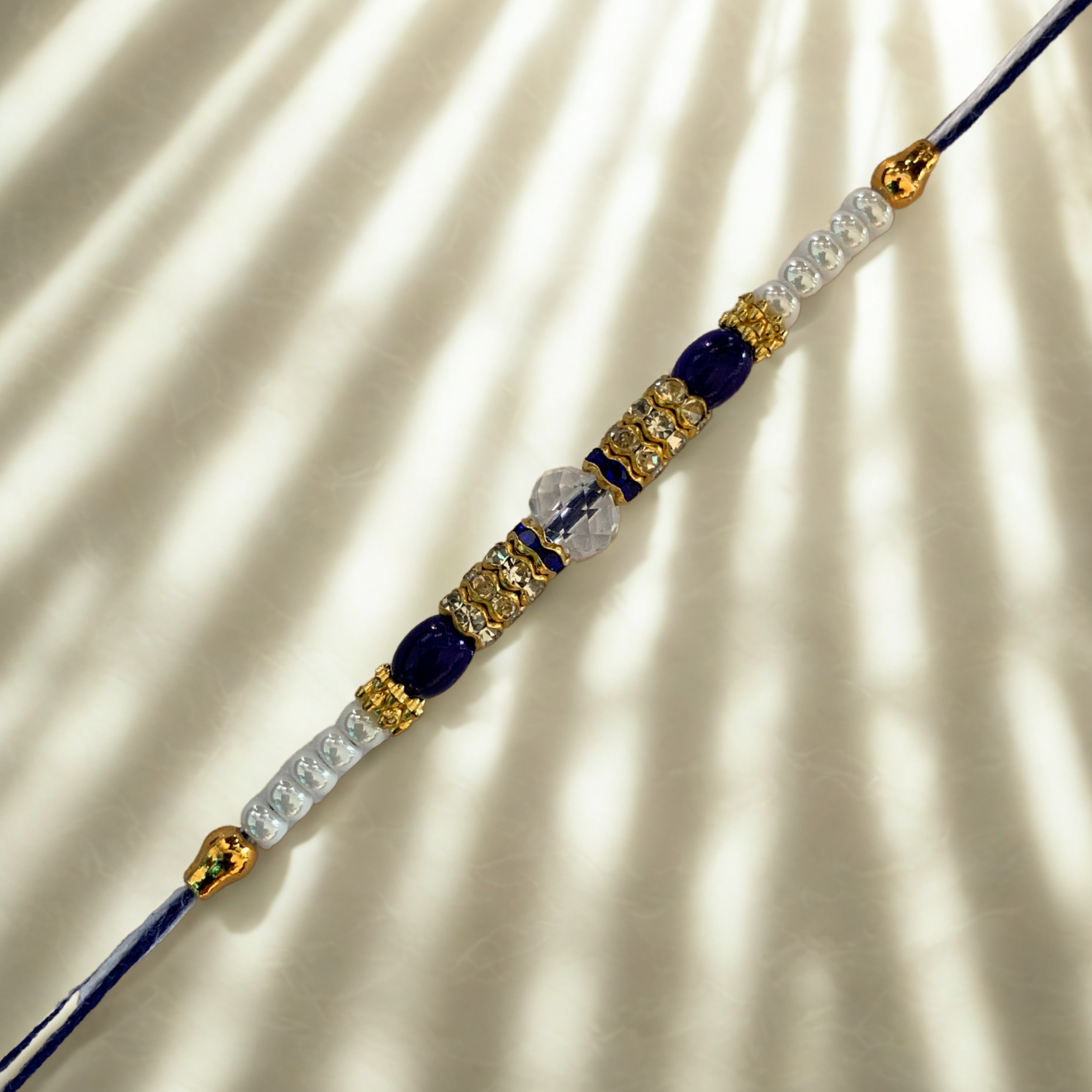 Royal Blue Crystal Rakhi with Golden Accents