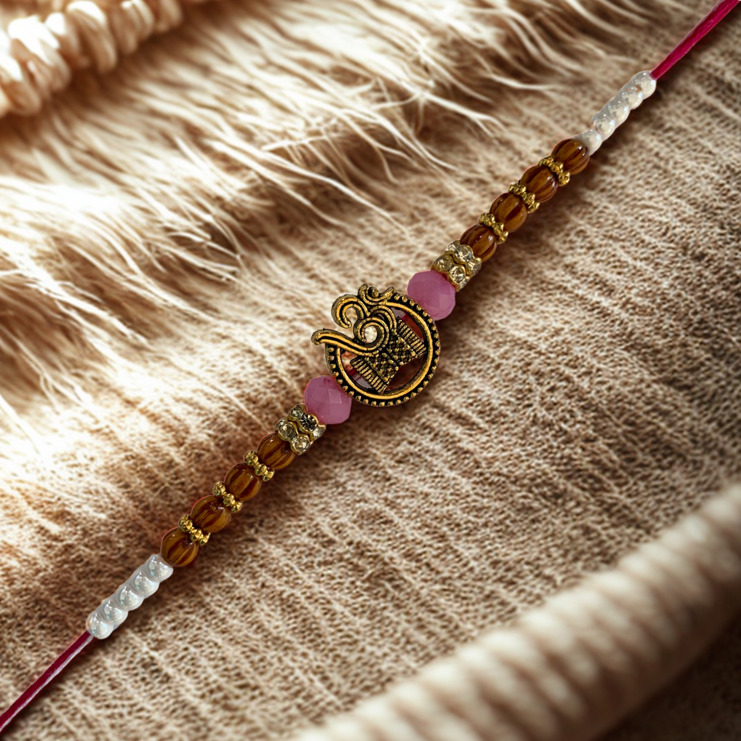 Spiritual Om Rakhi with Wooden & Pink Beads