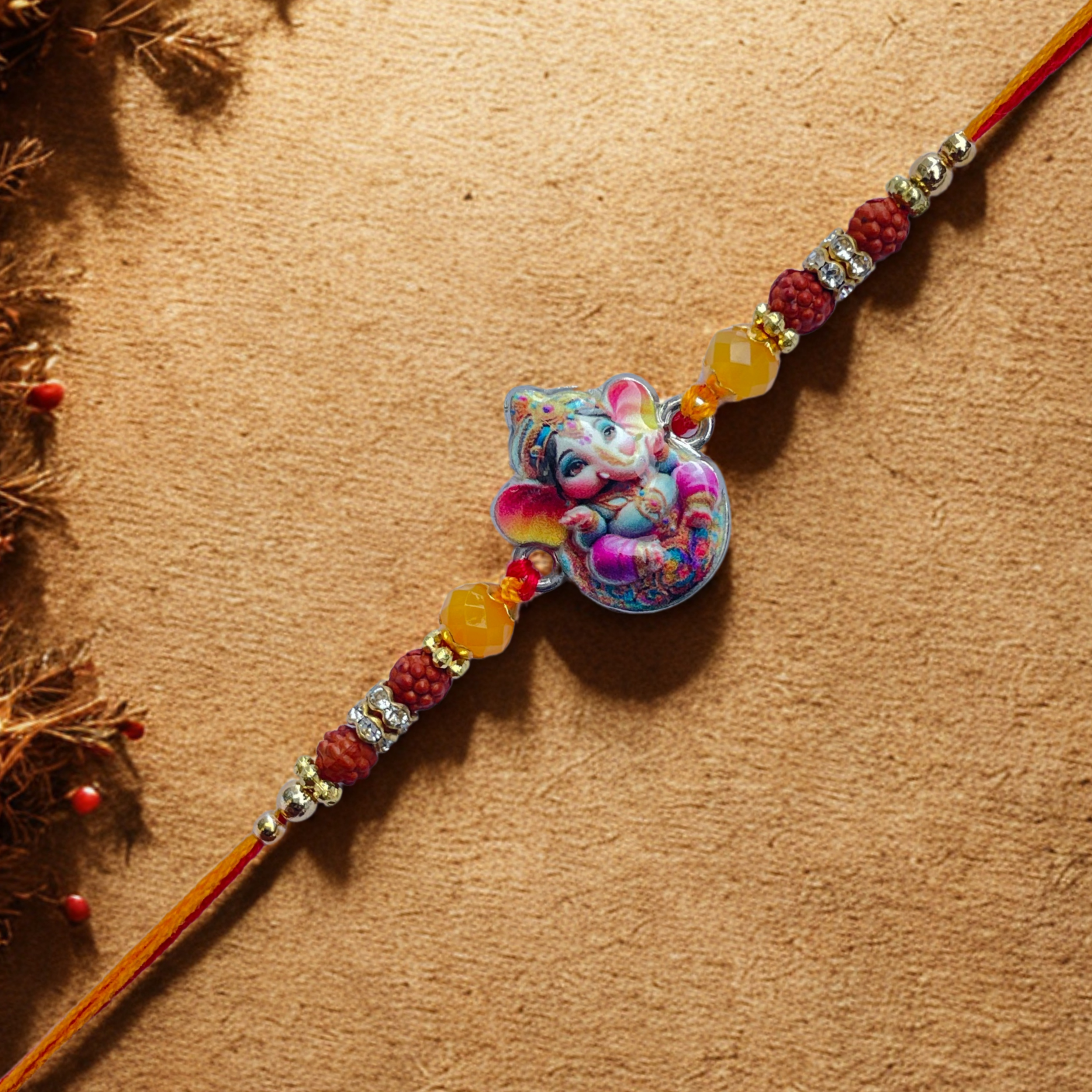 Blessed Ganesha Rakhi with Orange Beads & Thread