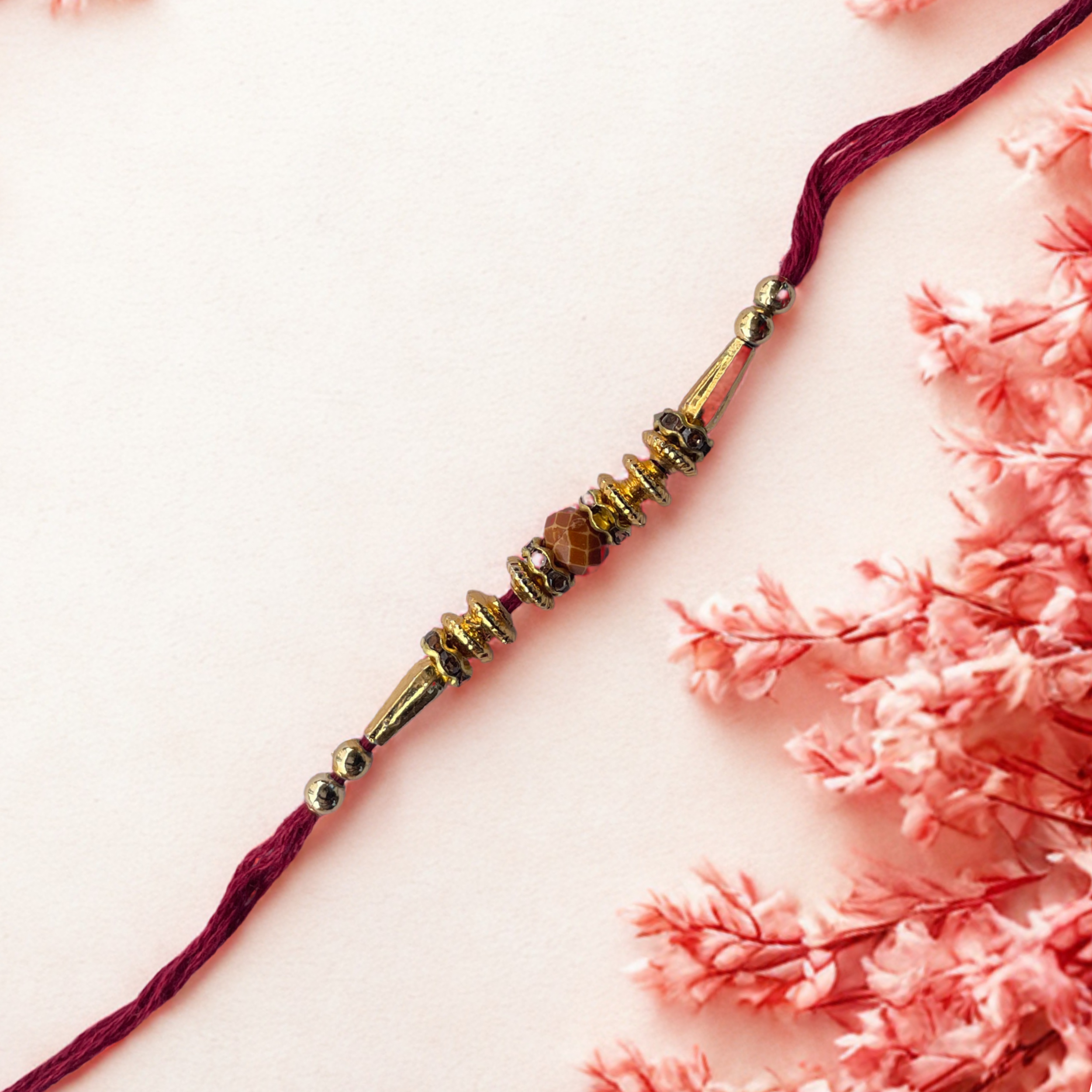 Elegant Maroon & Golden Beaded Rakhi for Brother