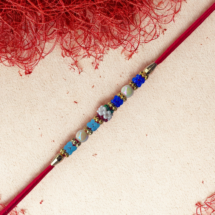 Colorful Beaded Rakhi with Pearls & Floral Accents
