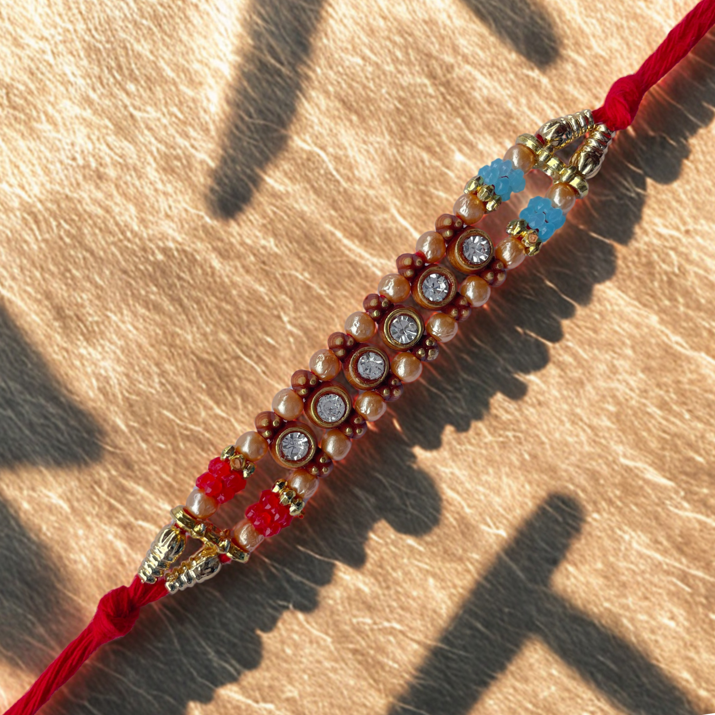 Designer Double-Strand Pearl Rakhi with Sparkling Stone