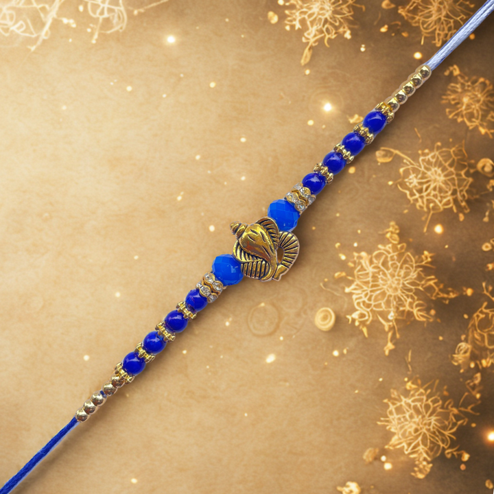 Ganesh Motif Rakhi with Blue Beads & Golden Accents