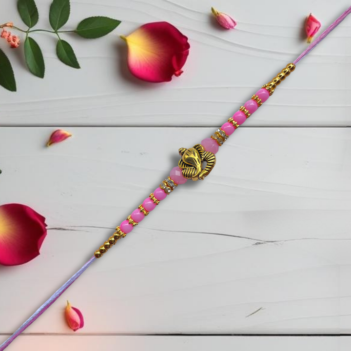 Ganesh Motif Rakhi with Light Pink Beads & Golden Accents