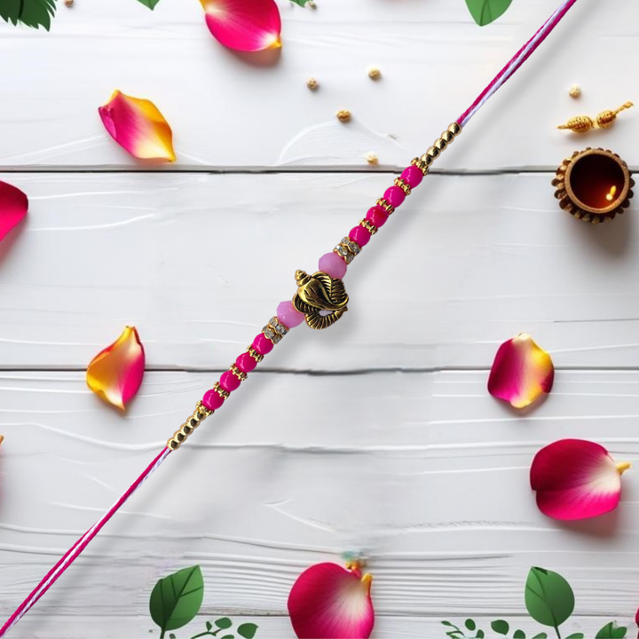 Ganesh Motif Rakhi with Pink Beads & Golden Accents