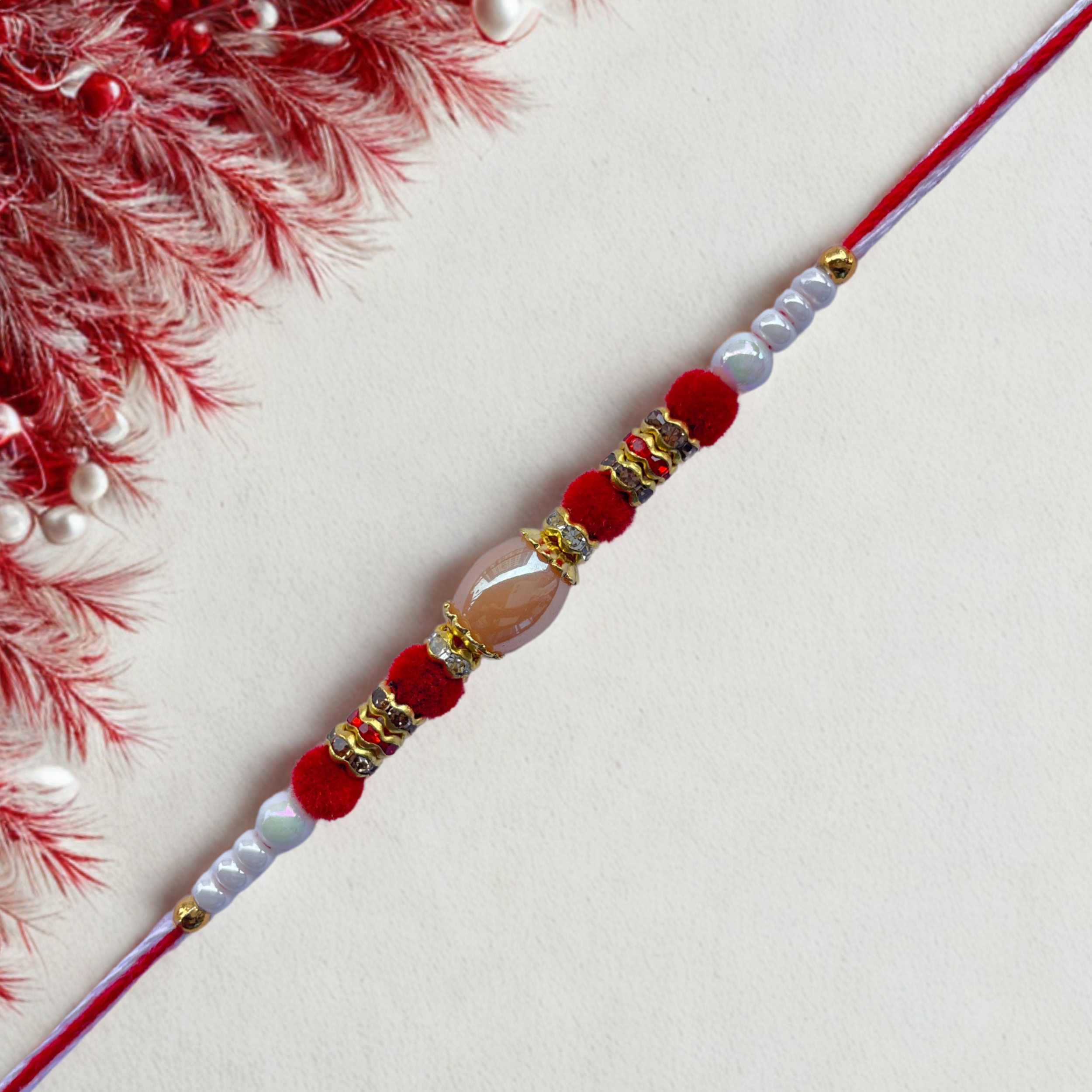 Elegant Red & White Beaded Rakhi with Central Crystal Bead