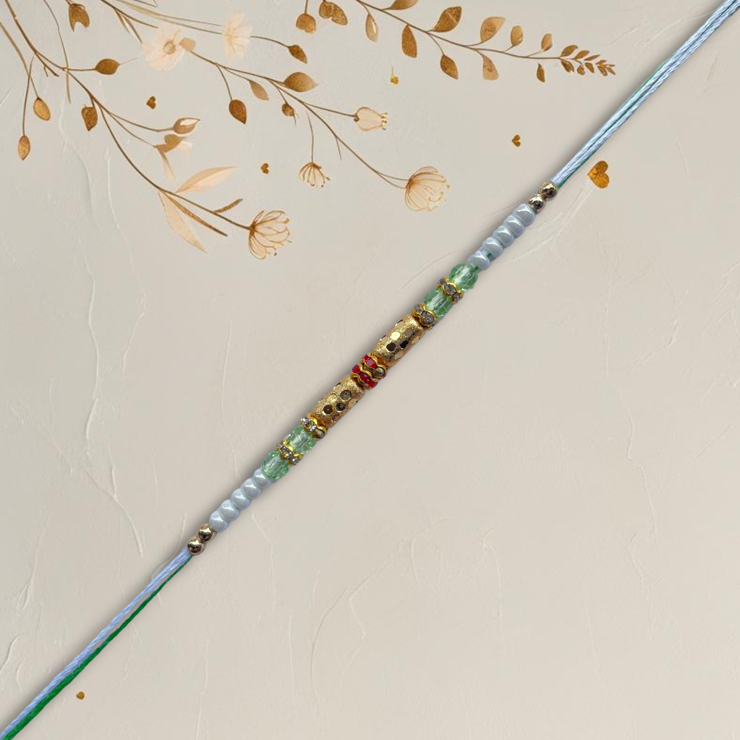 Classic Gold Barrel Bead Rakhi with Green & White Accents
