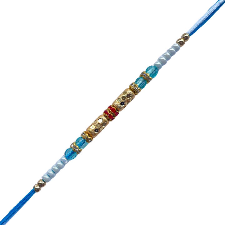 Classic Gold Barrel Bead Rakhi with Light Blue & White Accents