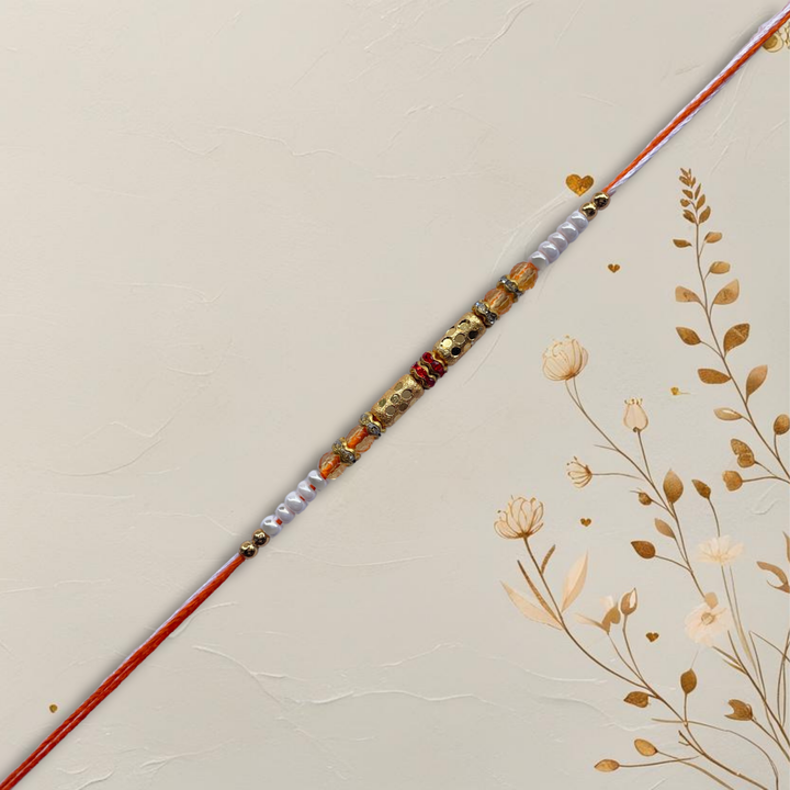 Classic Gold Barrel Bead Rakhi with Orange & White Accents
