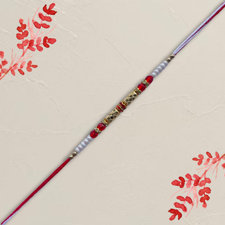 Classic Gold Barrel Bead Rakhi with Red & White Accents