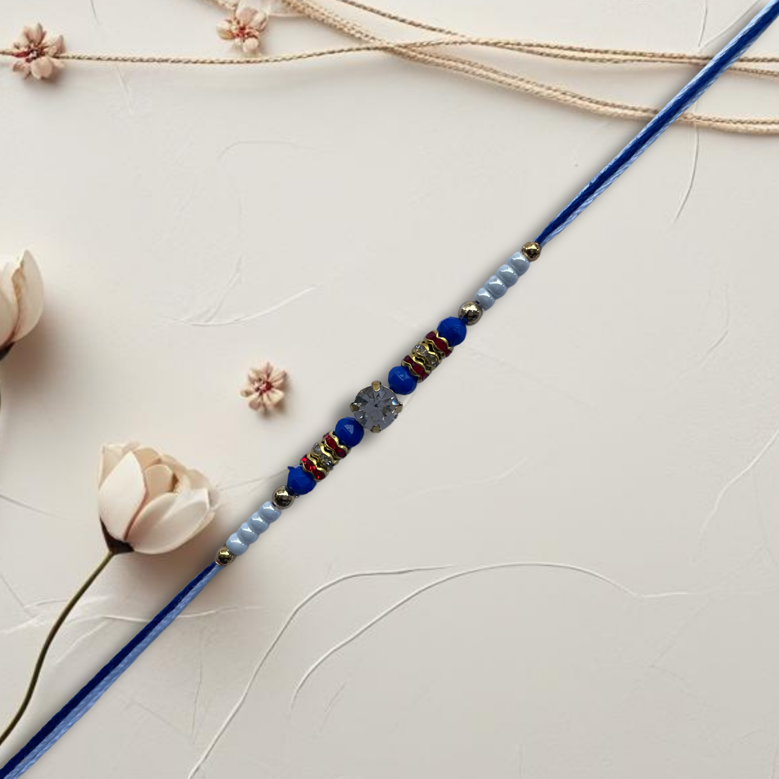 Elegant Blue Beaded Rakhi with Stone Centrepiece