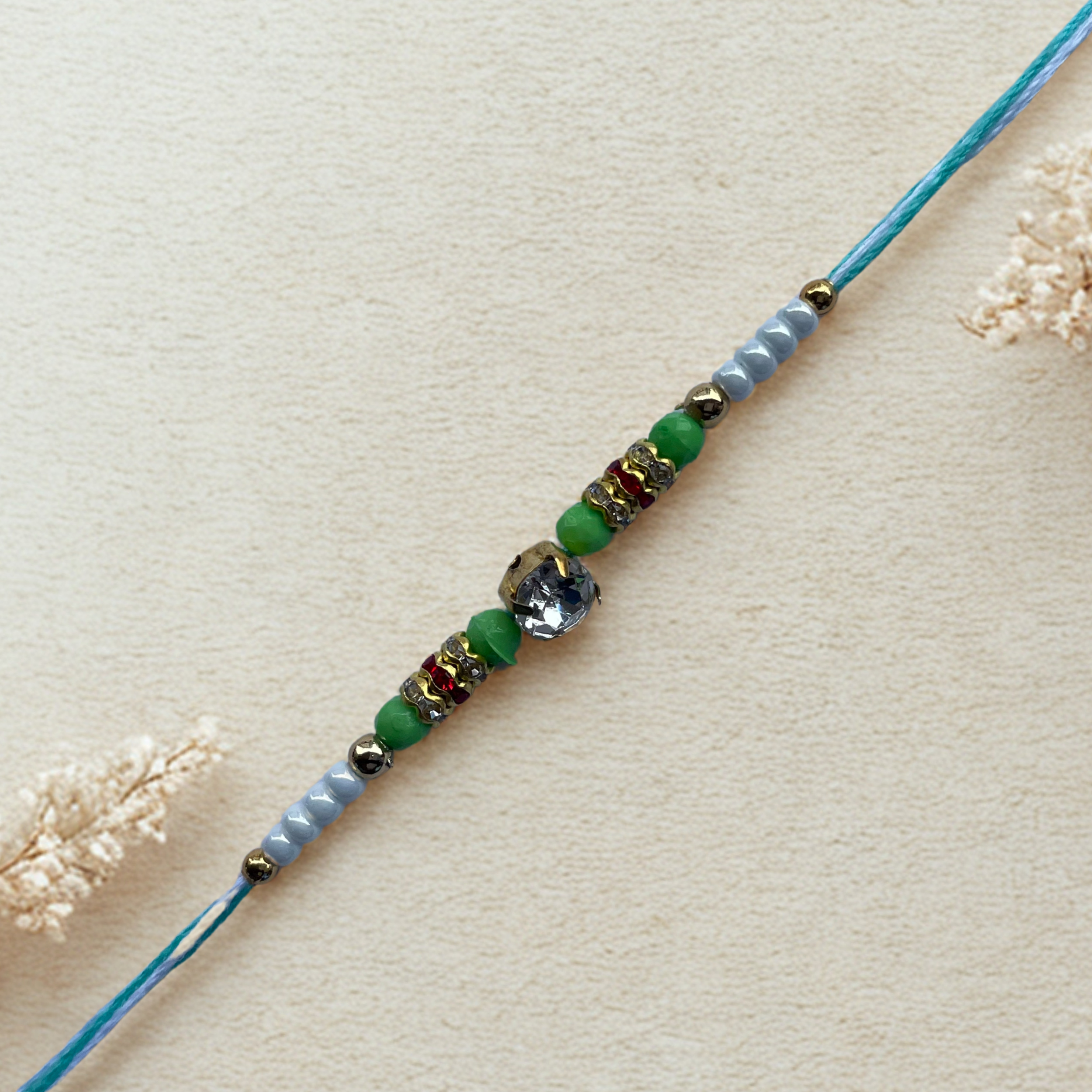 Elegant Green Beaded Rakhi with Stone Centrepiece
