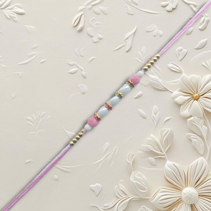 Light Pink Pearl Rakhi with Golden Bead Accents