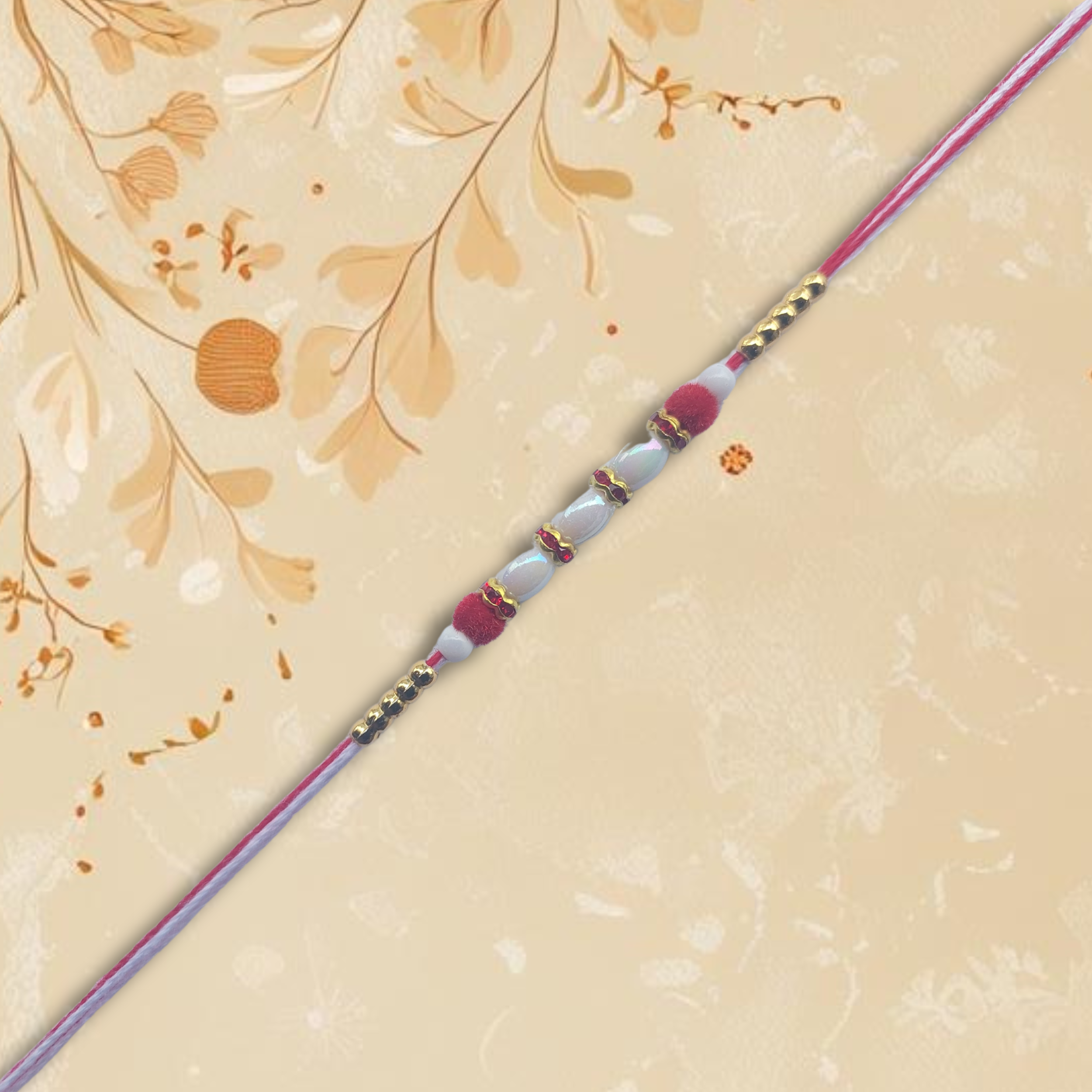 Red Pearl Rakhi with Golden Bead Accents