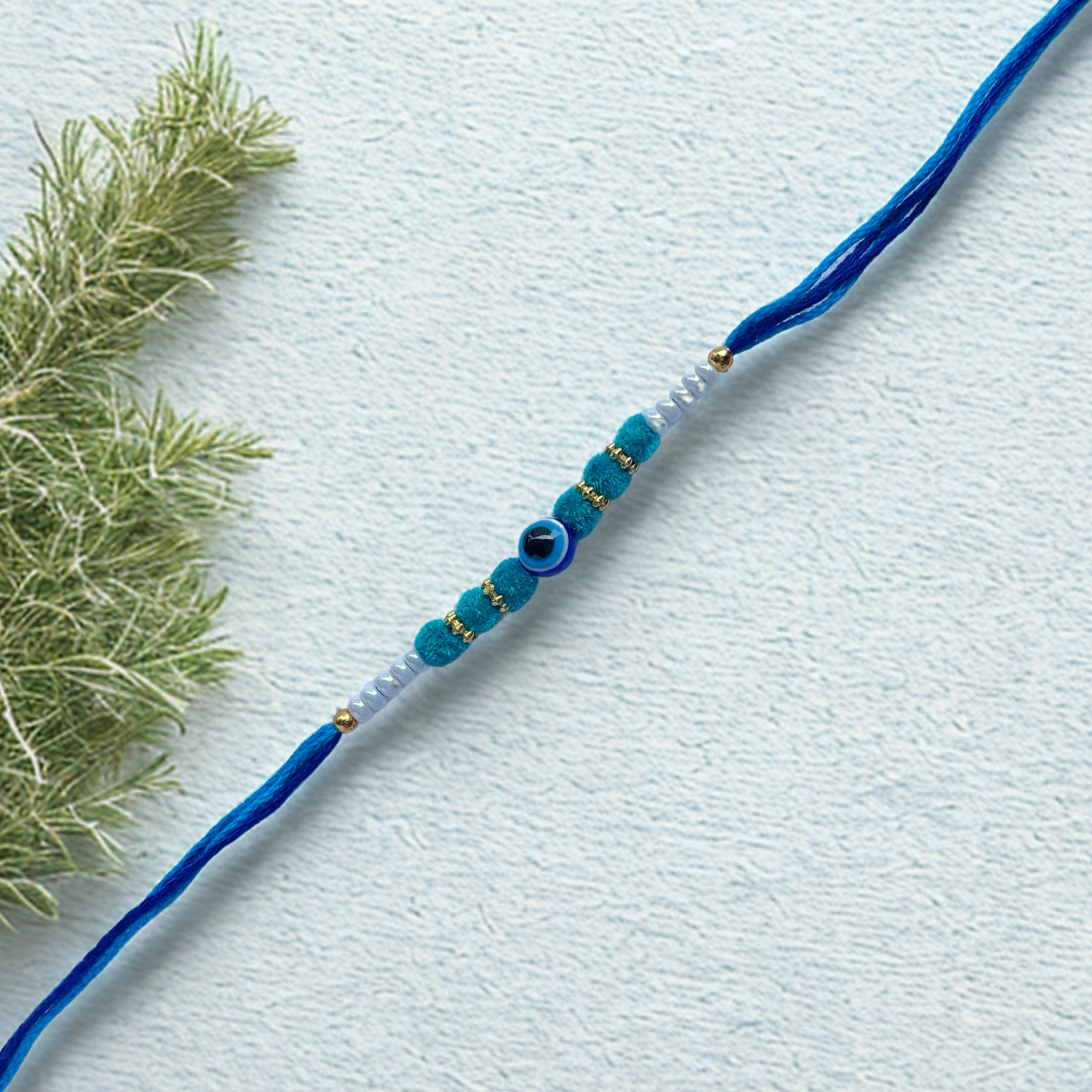 Teal Green Beaded Rakhi on Silk Thread