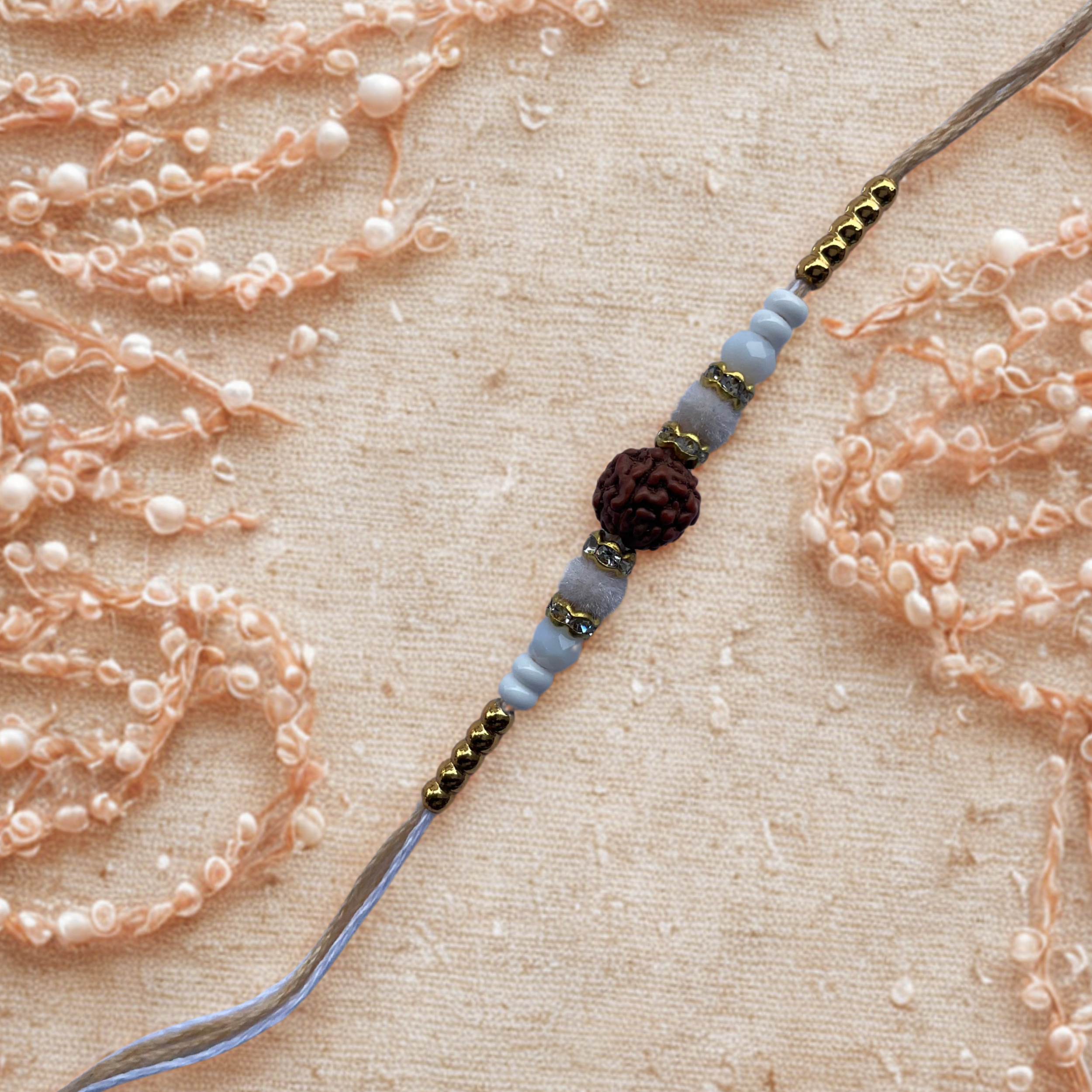 Traditional Rudraksha Rakhi with Light Cream Thread