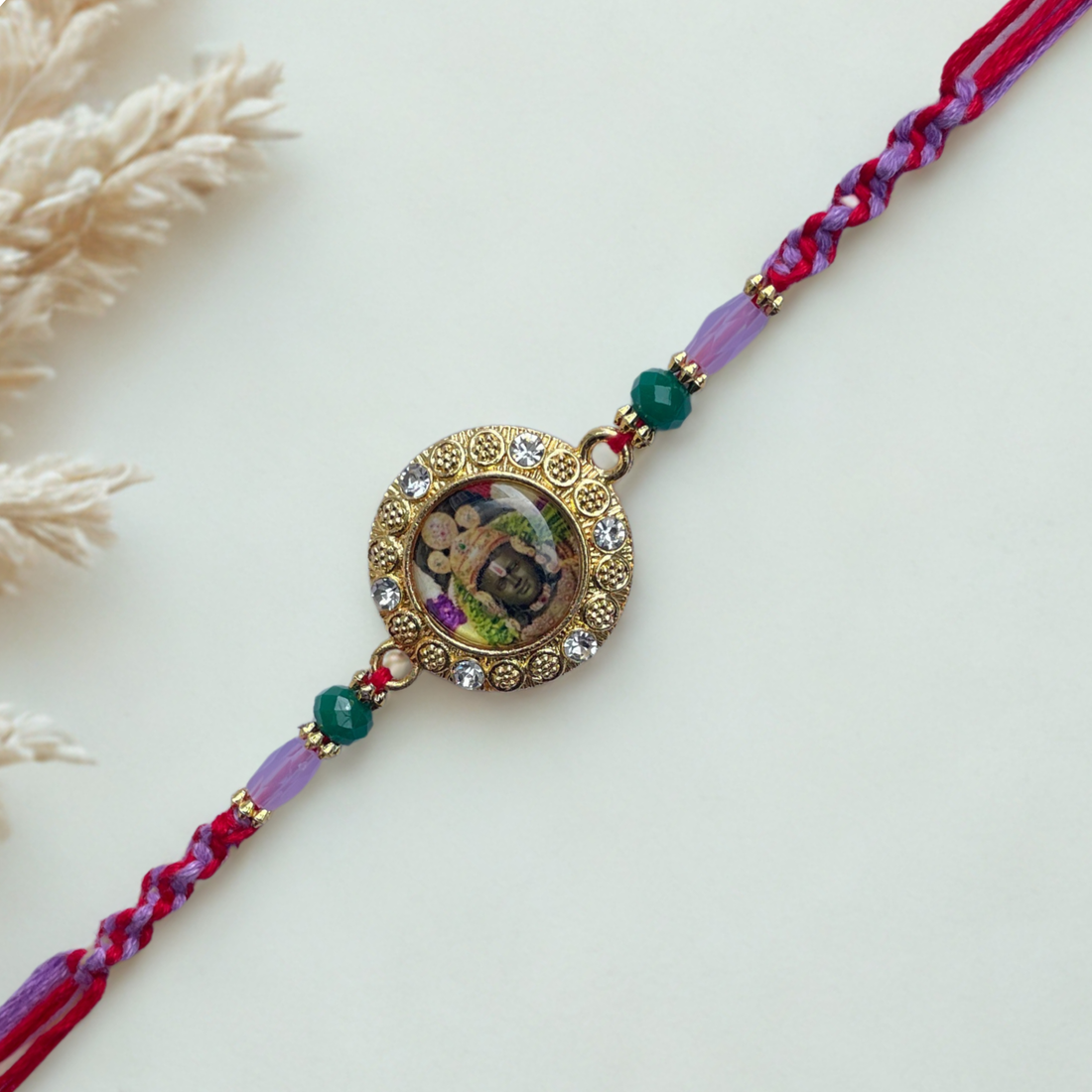Shree Ram Rakhi with Beads and Stone Studded Dial