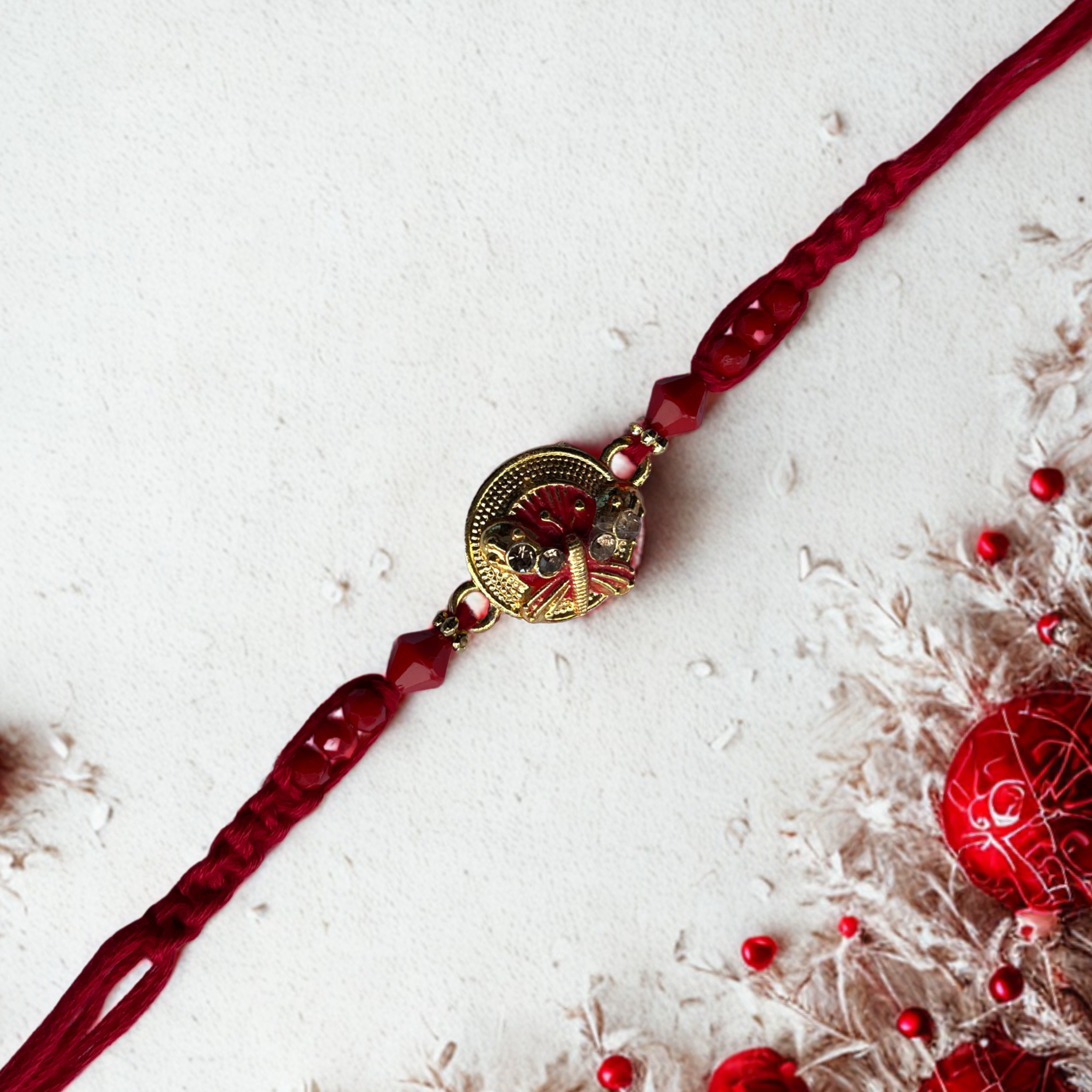Elegant Butterfly Rakhi with Red Beads and Thread