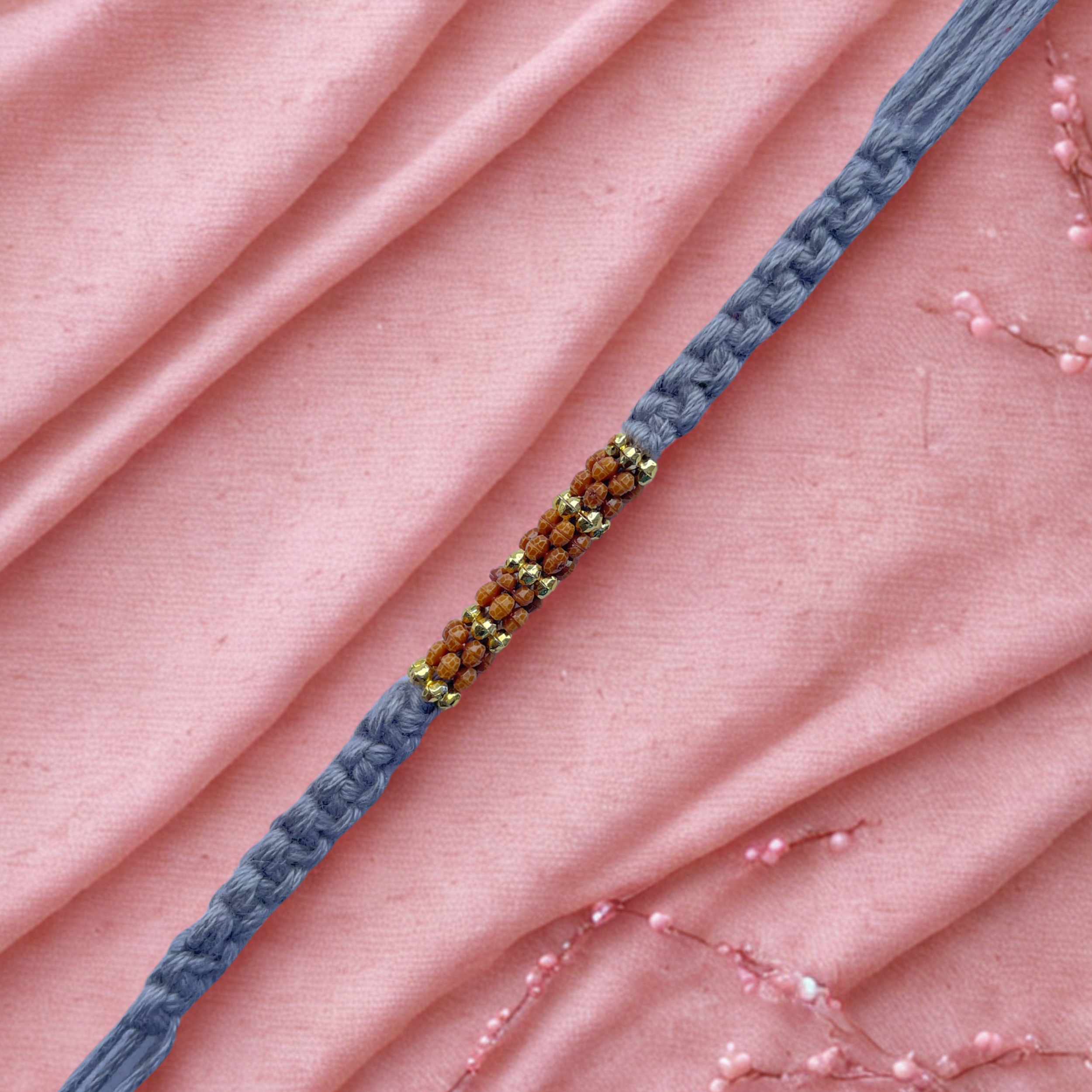 Elegant Rudraksha Rakhi with Handwoven Grey Thread