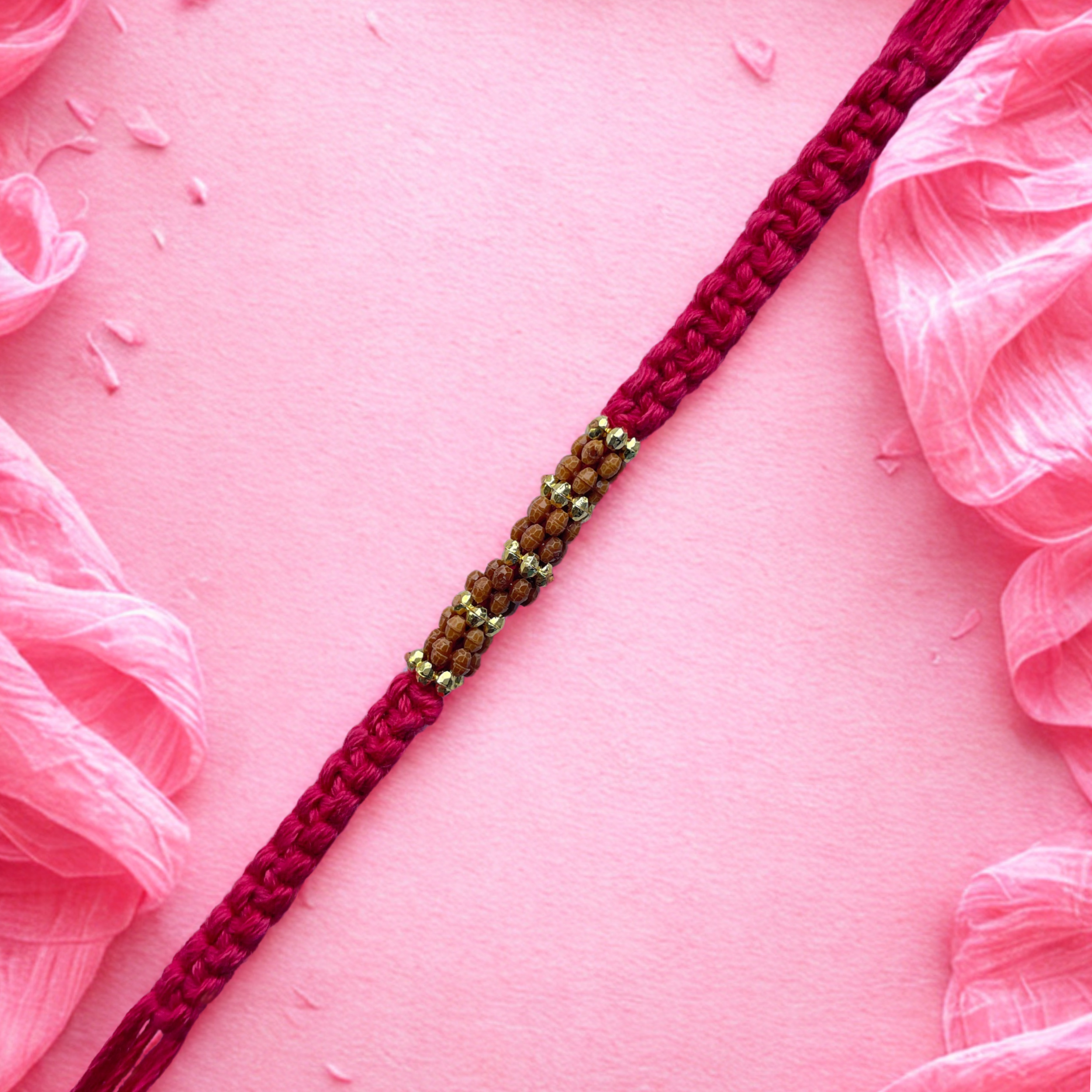 Elegant Rudraksha Rakhi with Handwoven Pink Thread