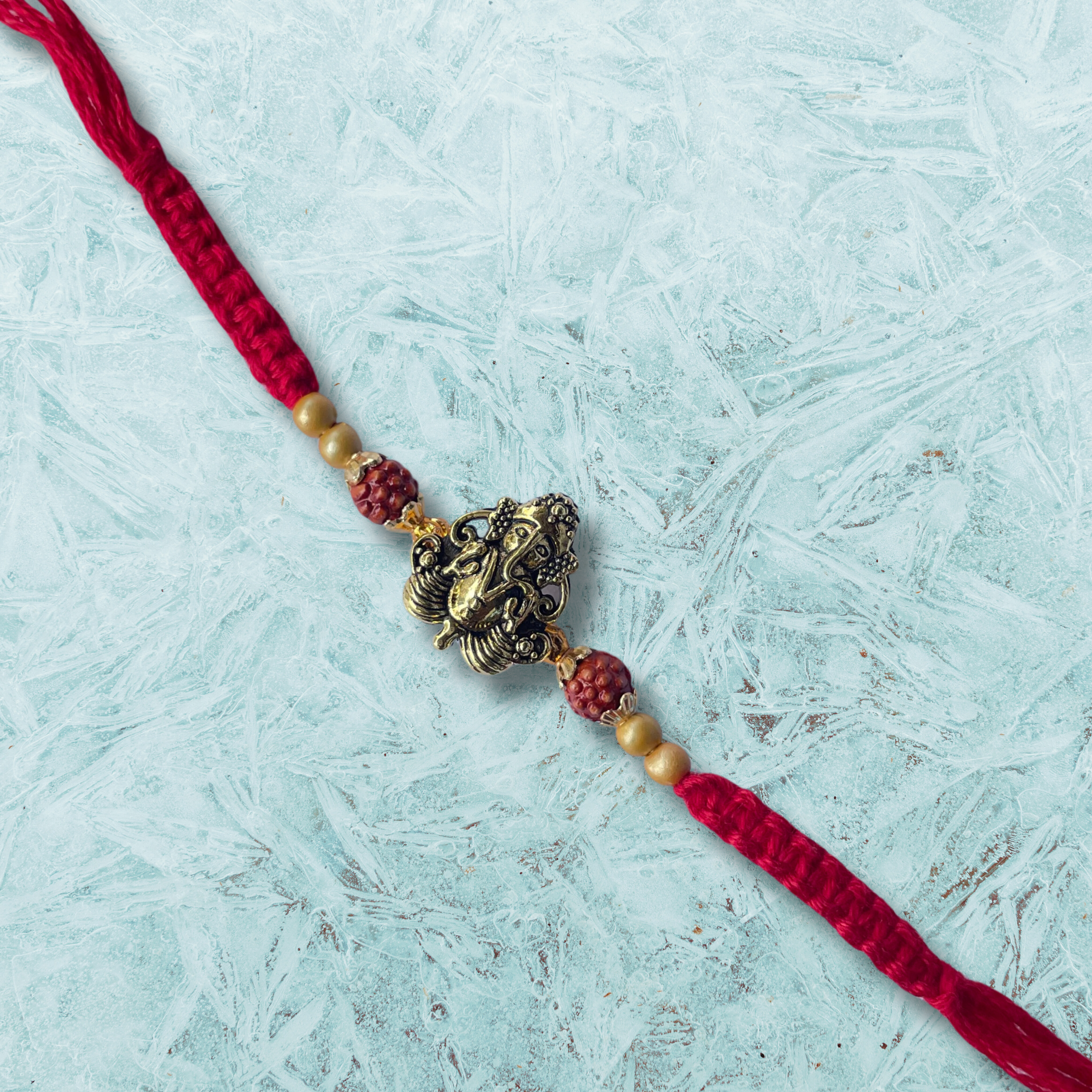 Ganesha Guardian Rakhi - Rudraksha Rakhi with Brass Ganesha for Brothers