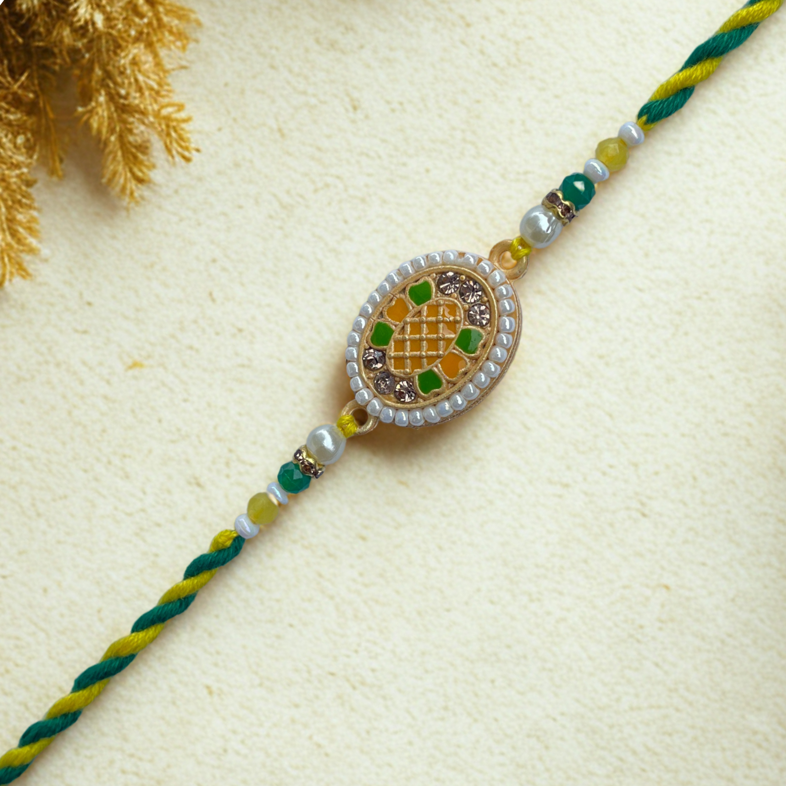 Elegant Meenakari Rakhi with Green-Yellow Thread