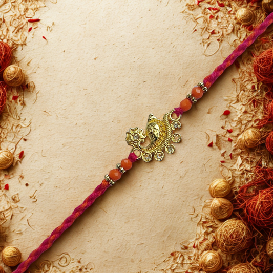 Antique Gold Paisley Rakhi with Crystal Embellishments