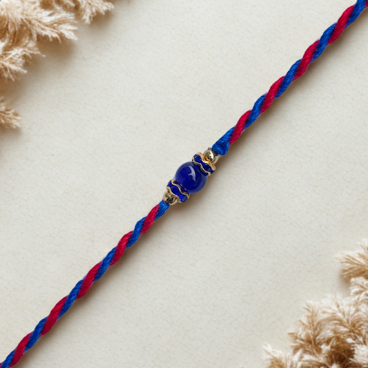Minimal Blue Bead Rakhi on Dual-Tone Thread