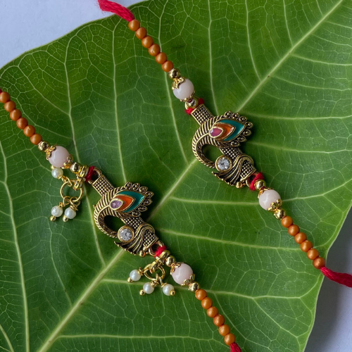 Divine Bond Rakhi with Elegant Peacock Motif and Beaded Grace