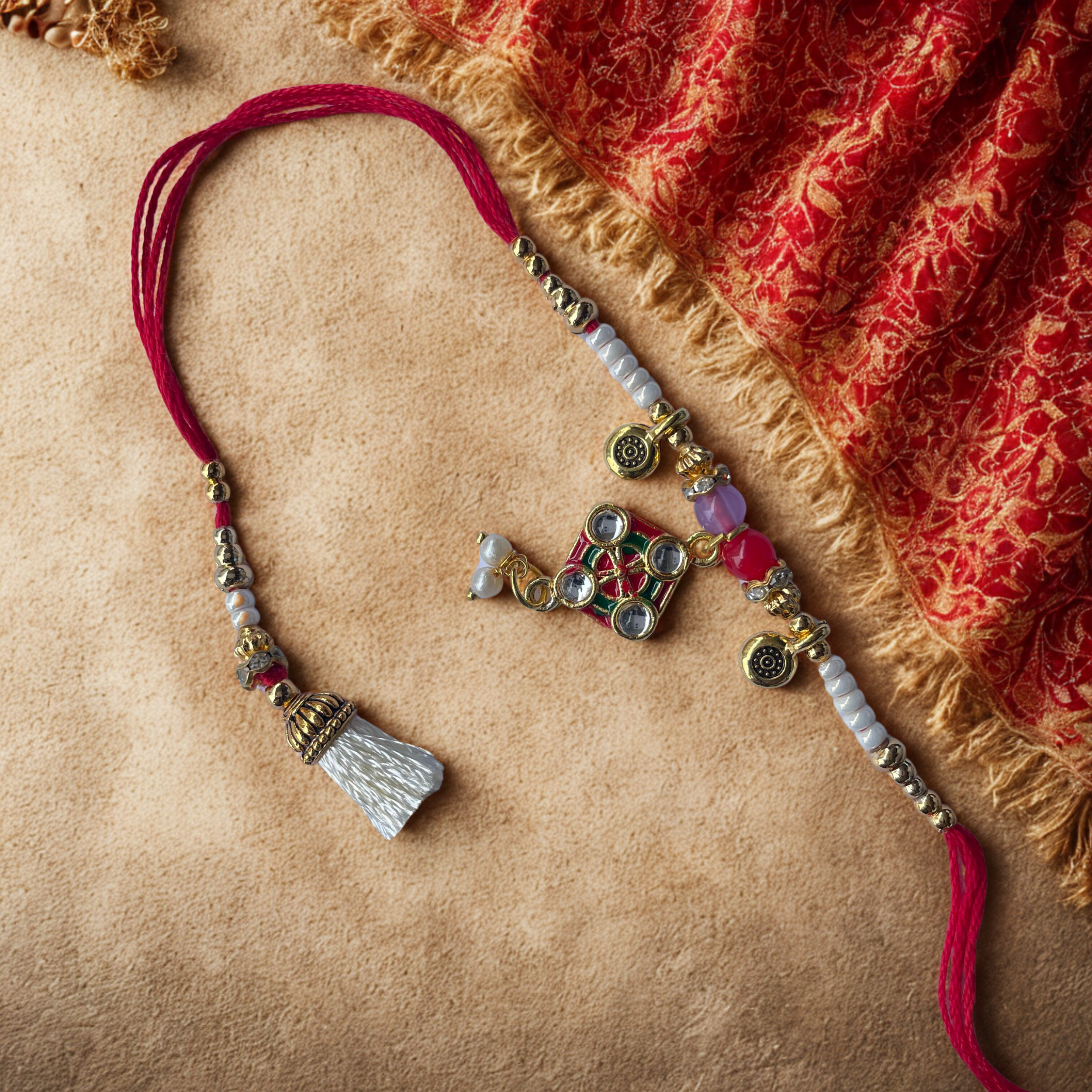 Divine Kalasham Sacred Charm Rakhi with Temple Bells and Beaded Thread