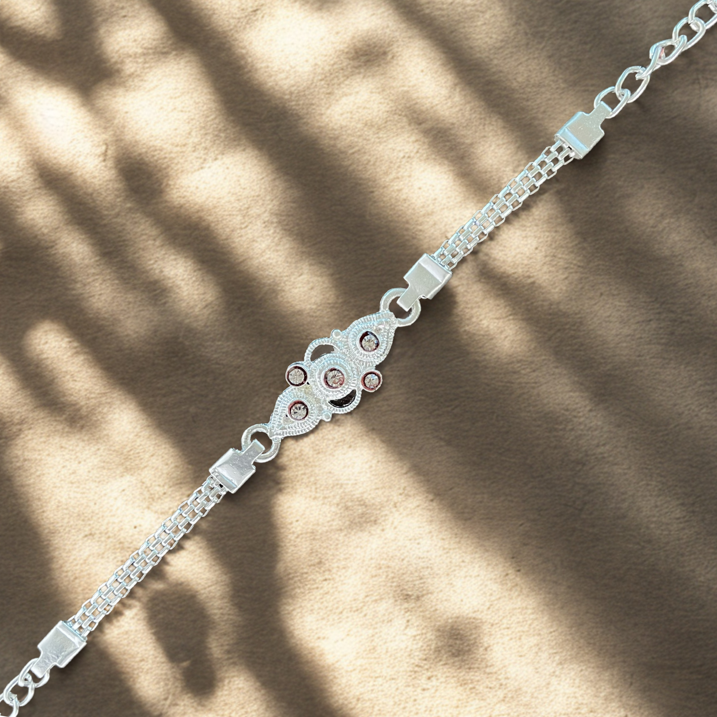 Elegant Silver Circular Pattern Rakhi for Brother